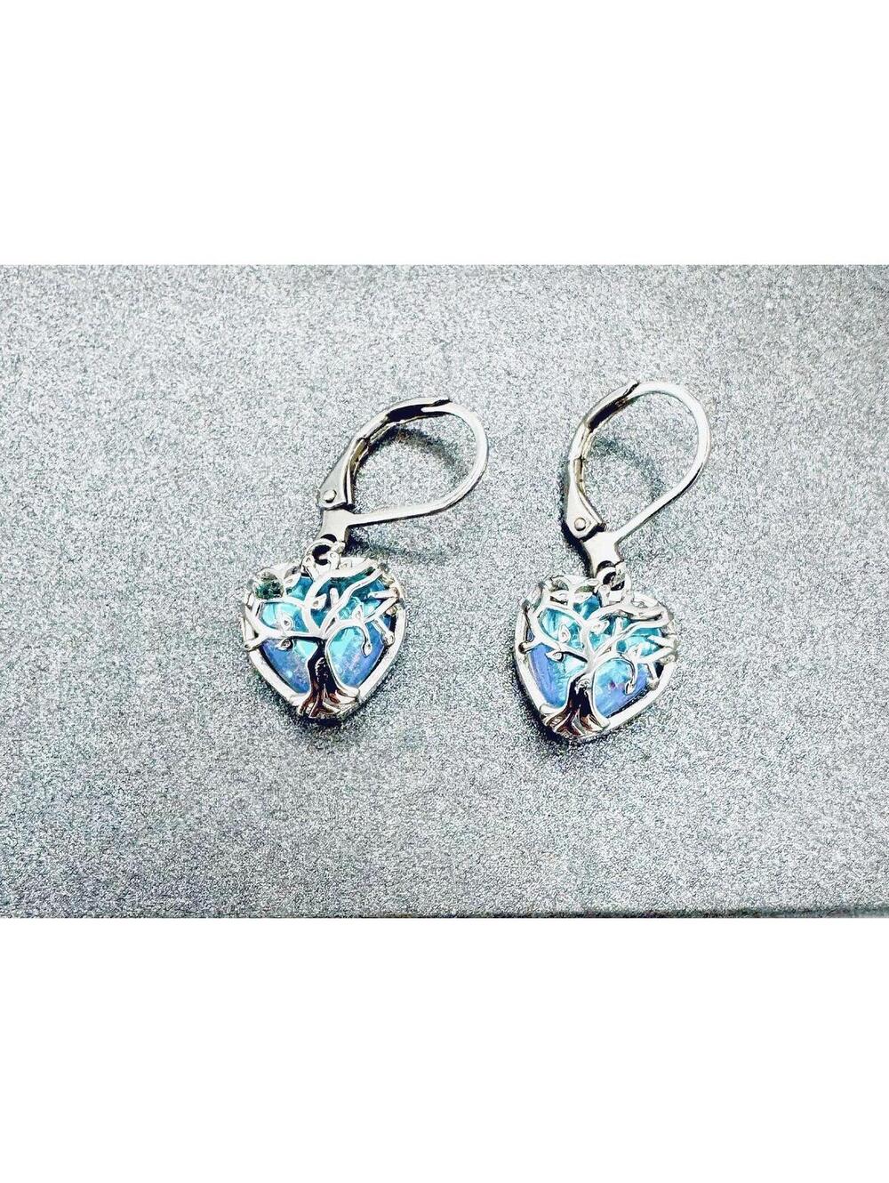 Sterling silver filigree "tree of life" encasing aurora borealis huggie earrings
